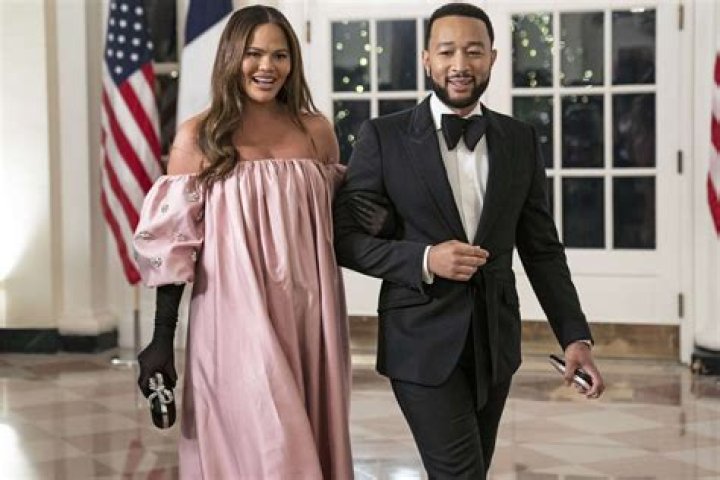
Pregnant Chrissy Teigen Shows Baby Bump in Pink Off-the-Shoulder Gown at White House State Dinner 